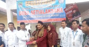 Lautan Merah Iringi Pendaftaran Nur Ali di Pilkades Setialaksana, Yel-yel “Perubahan” Bergema Sepanjang Jalan